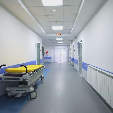 long empty corridor of hospital. long hallway with medical gurney in the hospital