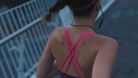 fit athlete running, listening to music