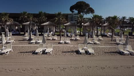 low angle shot of sandy beach beds for travelers to relax
