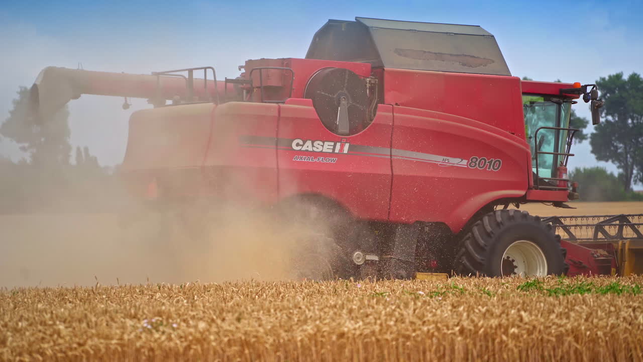 Combine Harvester Harvesting Wheat Field