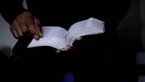 man praying with bible with black background with people stock video stock footage