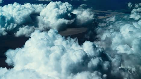 puffy clouds from above, flyover fluffy cloud formation shot