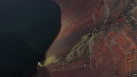 aerial tilt up shot extreme crater with lake named ljotipollur in iceland