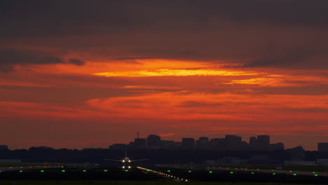 airplane landing/takeoff at sunset over city