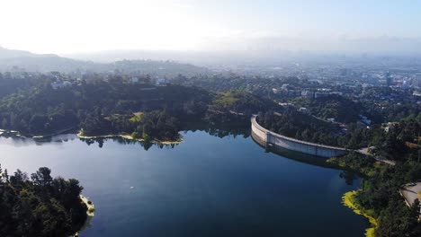 hollywood reservoir. birds-eye-view. morning with los angeles downtown in the background.  13sec.