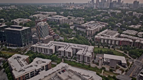 Atlanta-Georgia-Aerial-v882-hyperlapse-flyover-Poncey-Highland-across-O4W-capturing-neighborhood-city-park,-tilt-up-reveals-downtown-cityscape-on-the-skyline---Shot-with-Mavic-3-Pro-Cine---May-2023