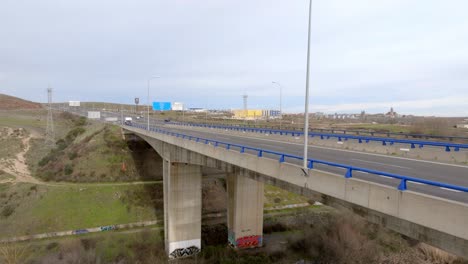 Traffic-on-public-viaduct-highway-over-the-river-in-the-city-of-Salamanca,-Spain