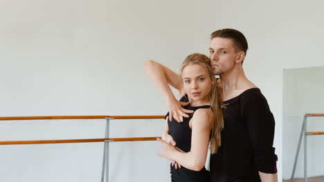 professional dance couple training in a studio