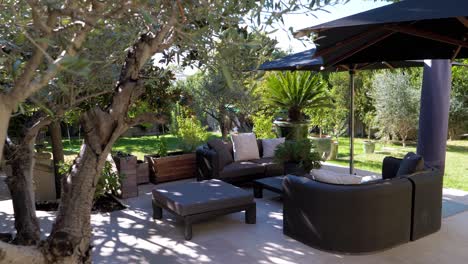 slow revealing shot of an outdoor seating area with umbrellas at a castle garden