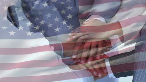 animation of american flag waving over multi ethnic businessmen and businesswomen