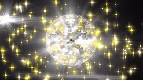 animación de estrellas y bola de discoteca girando sobre fondo negro con luces