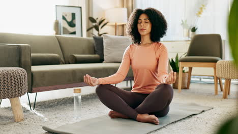 woman practicing yoga and meditation at home