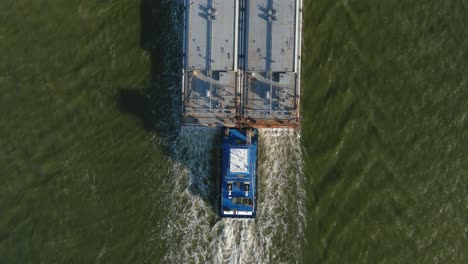 Aerial-establishing-shot-of-large-tanker-boat-in-water