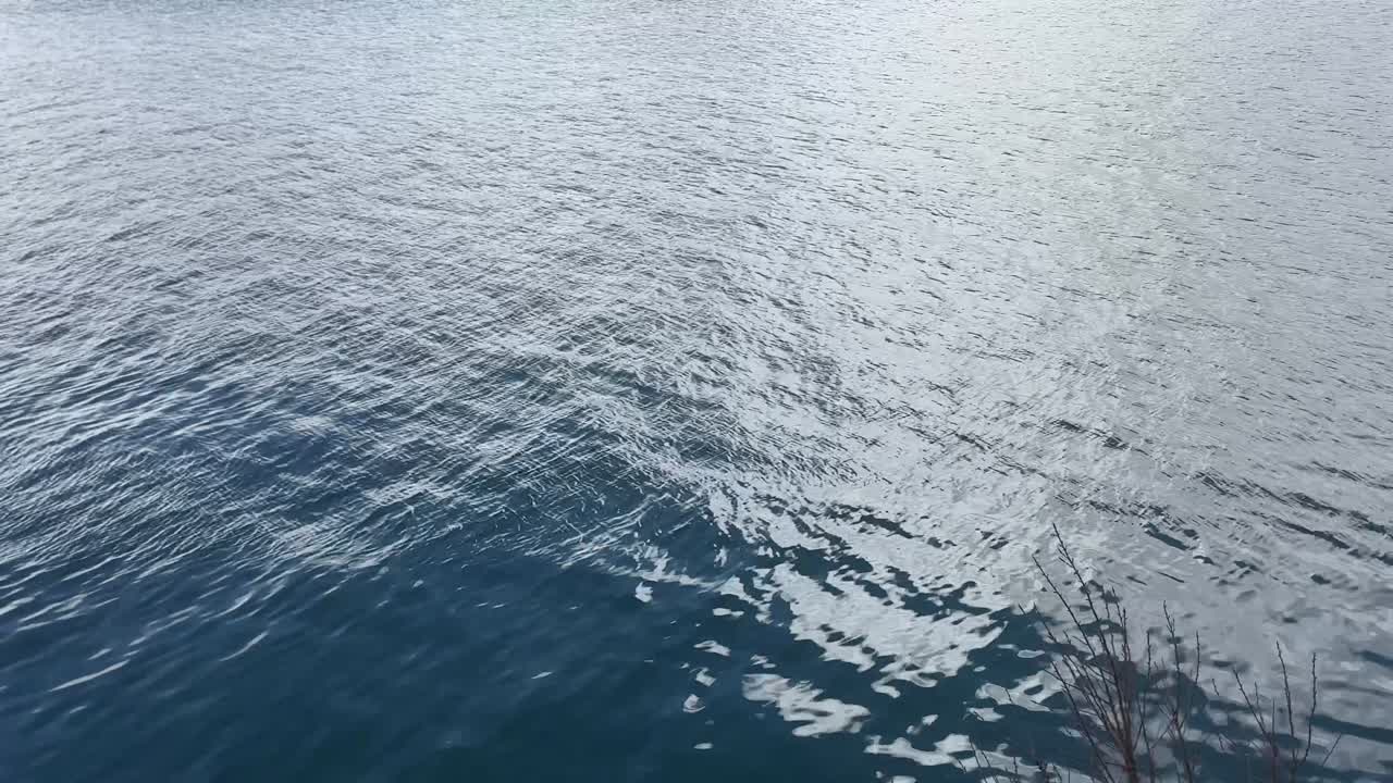 A placid calm sea with small tide.