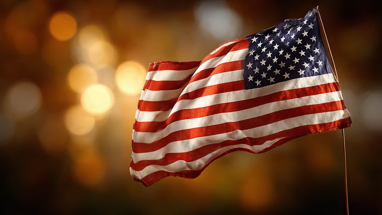Waving American Flag Against a Beautiful Bokeh Background, Symbolizing Freedom and National Pride with Vibrant Colors and Rich Textures