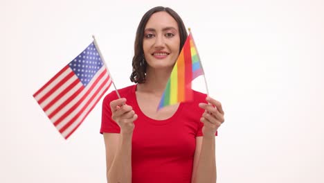 Woman holding American and LGBTQ pride flags