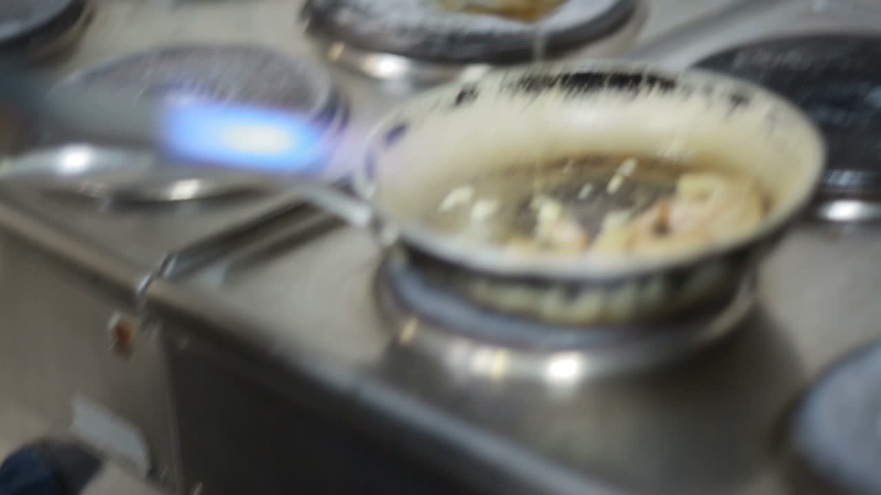 Fry Shrimp In A Frying Pan. Shrimp is frying in pan on restaurant kitchen