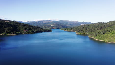 Bright-Skies-Blue-River-And-Green-Vast-Forest-In-Portugal---aerial-shot