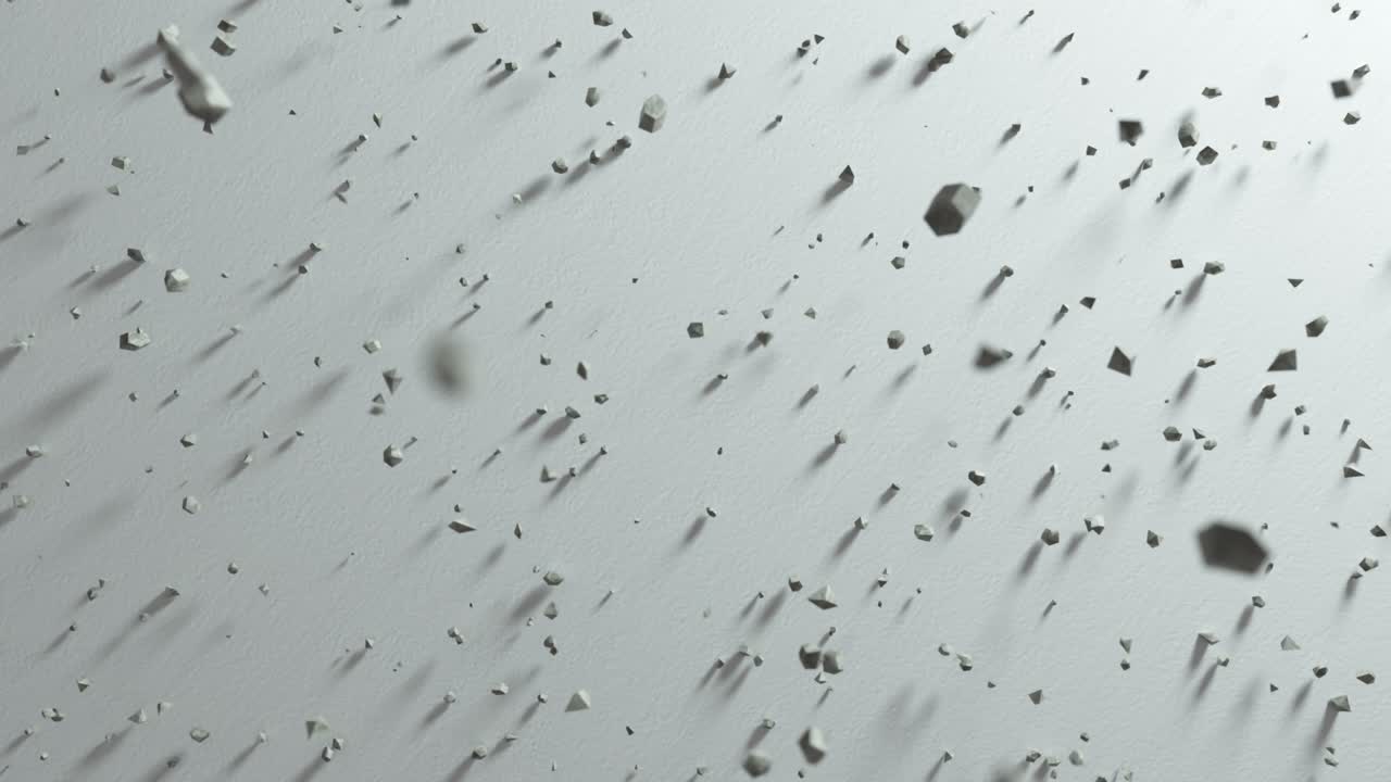 rocas abstractas que caen en una superficie gris claro