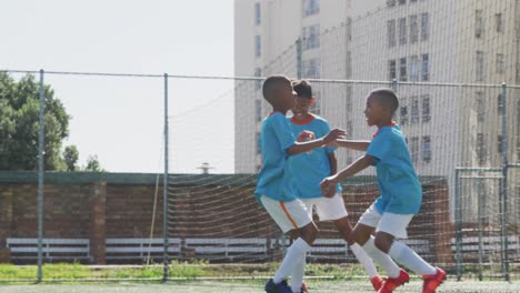 soccer kids playing in a sunny day