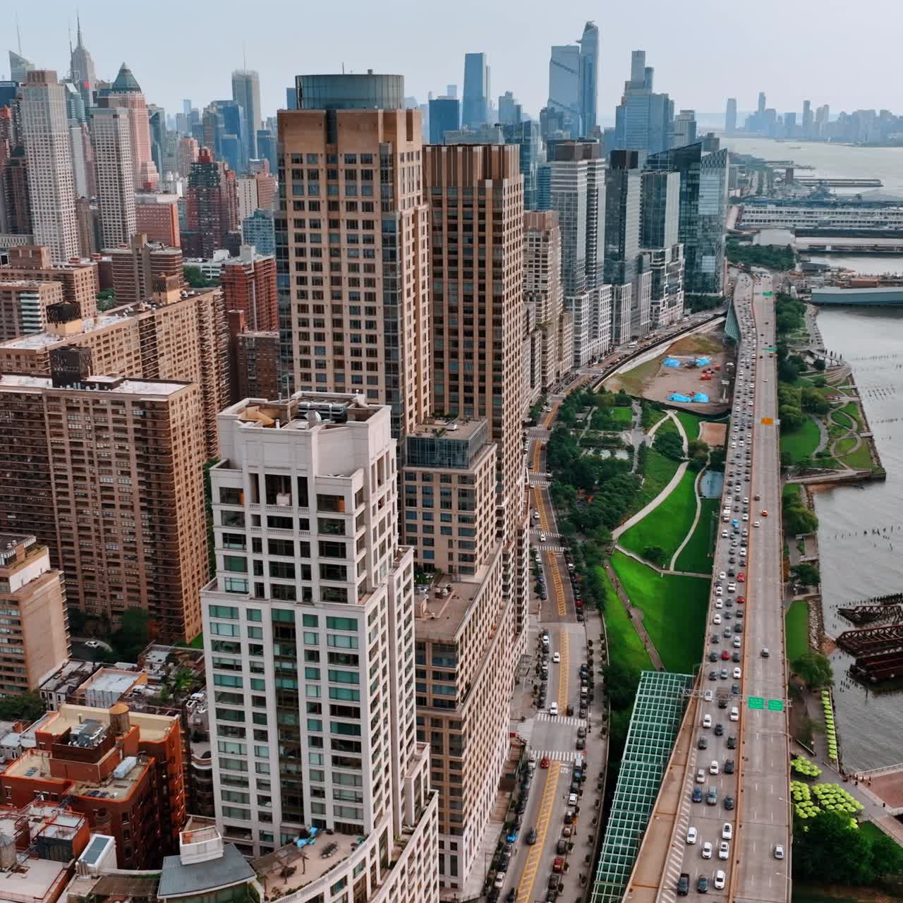 Downtown of New York above Hudson River. Busy traffic on the roads of the city from top view