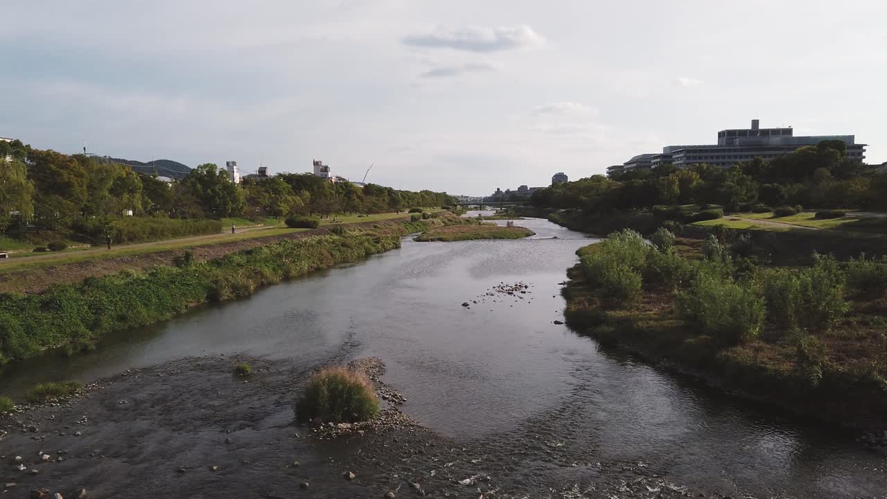 Panoramic Autumn Daylight View of the Kamogawa River Flow Through Kyoto, Japan