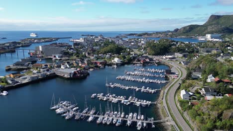 svolvaer harbour fishing village in lofoten islands, norway - aerial 4k pedestal