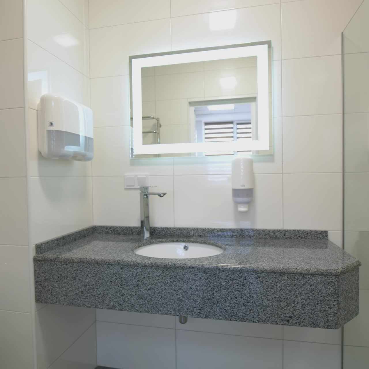 Interior of light modern bathroom. Front view of bathroom interior with shower