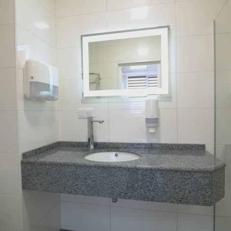 interior of light modern bathroom. front view of bathroom interior with shower