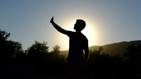 Silhouette-waving-hand