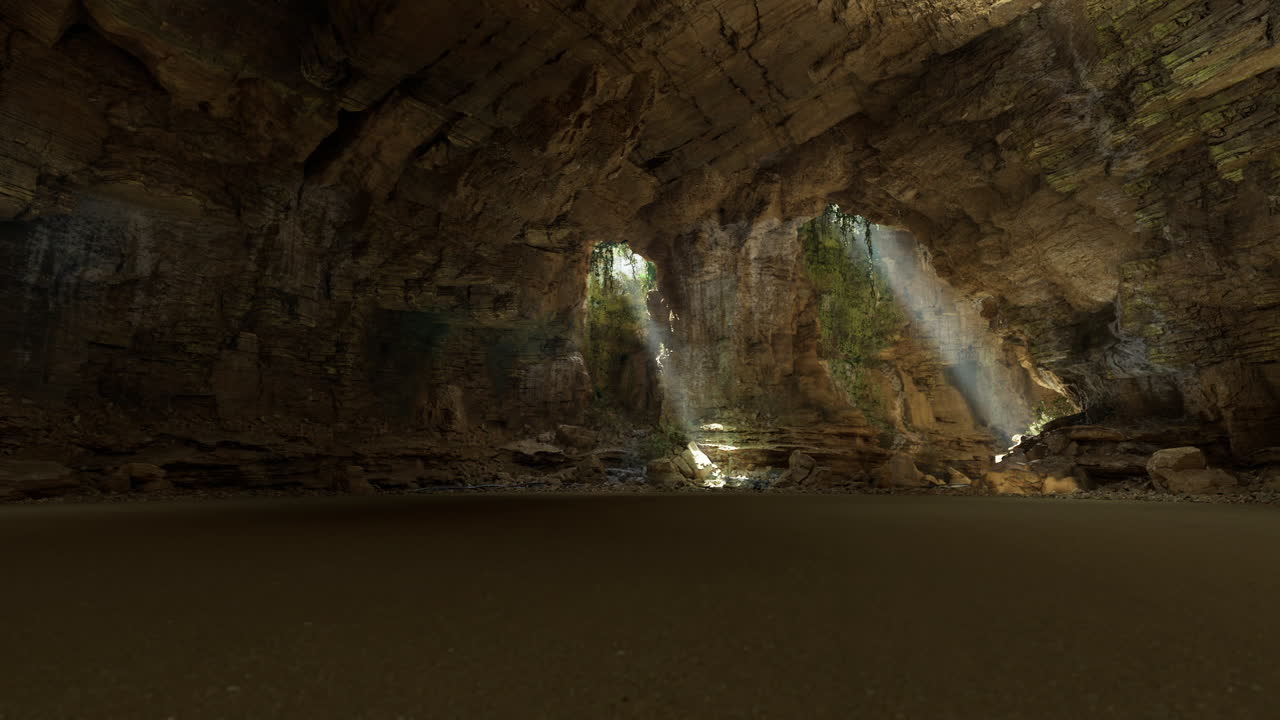 La luce del sole filtra attraverso un'apertura illuminando un morbido terreno sabbioso