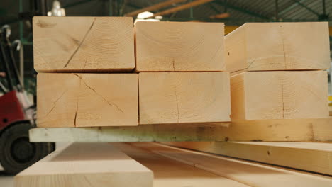 close view of wooden panels moved by a machine in a factory