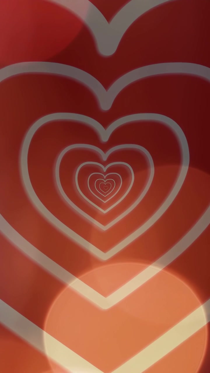 Video verticale: Inizio di un loop con cuori annidati che pulsano verso l'interno mentre l'effetto bokeh si sposta, formando un pannello a loop.