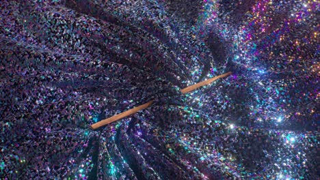 magic wand on glittery fabric