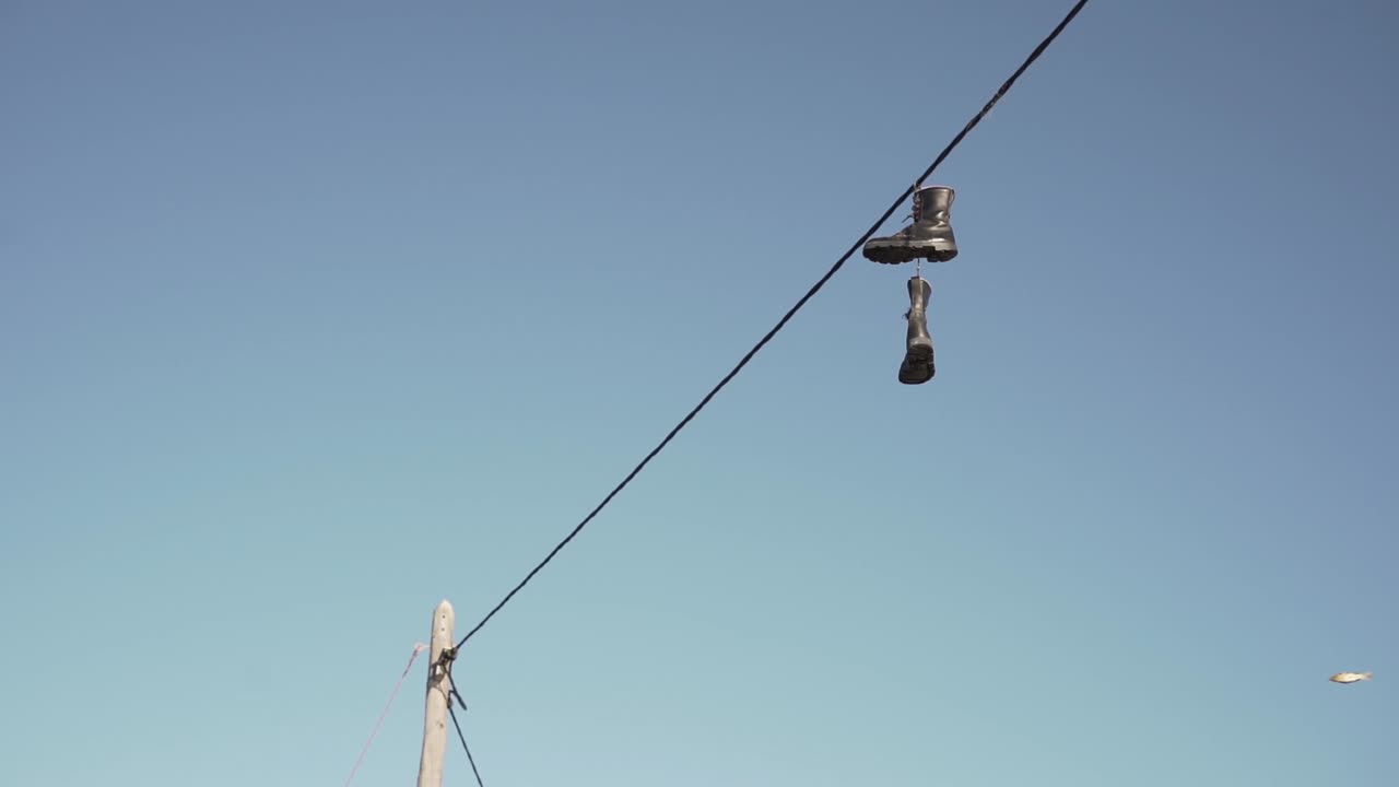 Boots Hanging on a Power Line