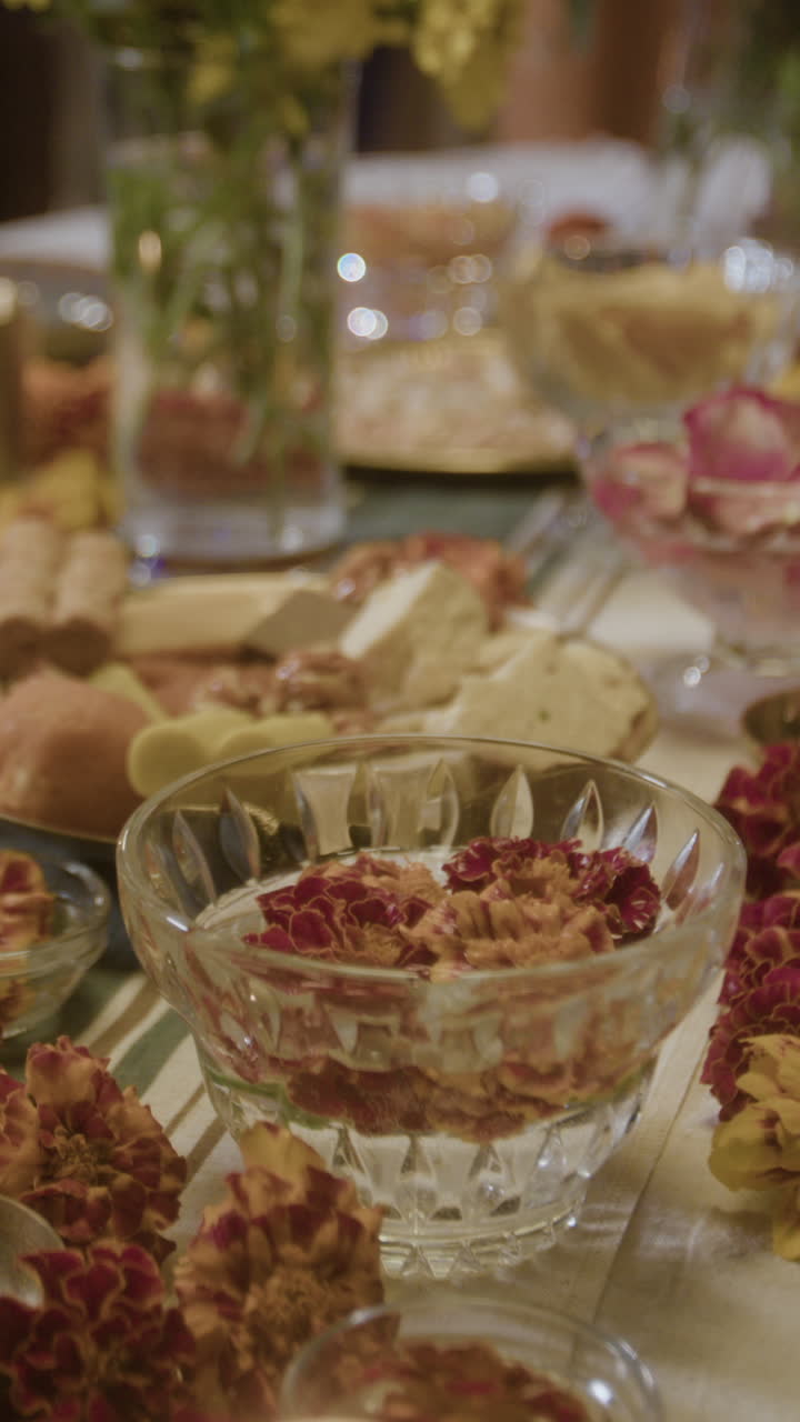 Close-up of beautifully decorated table with food and flowers