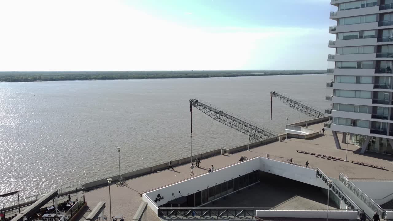 Riverfront Cityscape with Modern Buildings and Walkway