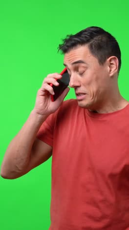 Man talking on the phone on green screen
