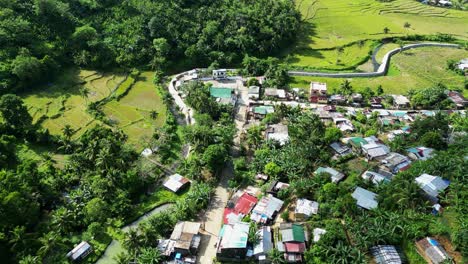 aerial view of countryside settlements near tropical forest in baras, province of catanduanes, philippines