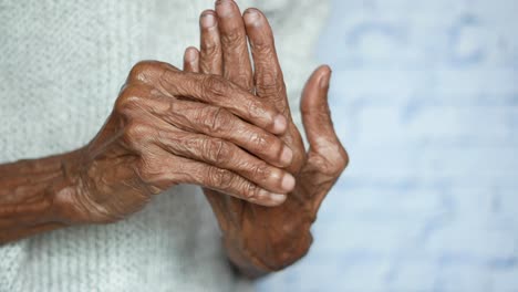 elderly hands with potential arthritis