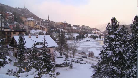 establishing shot of the town of st moritz switzerland in winter 2