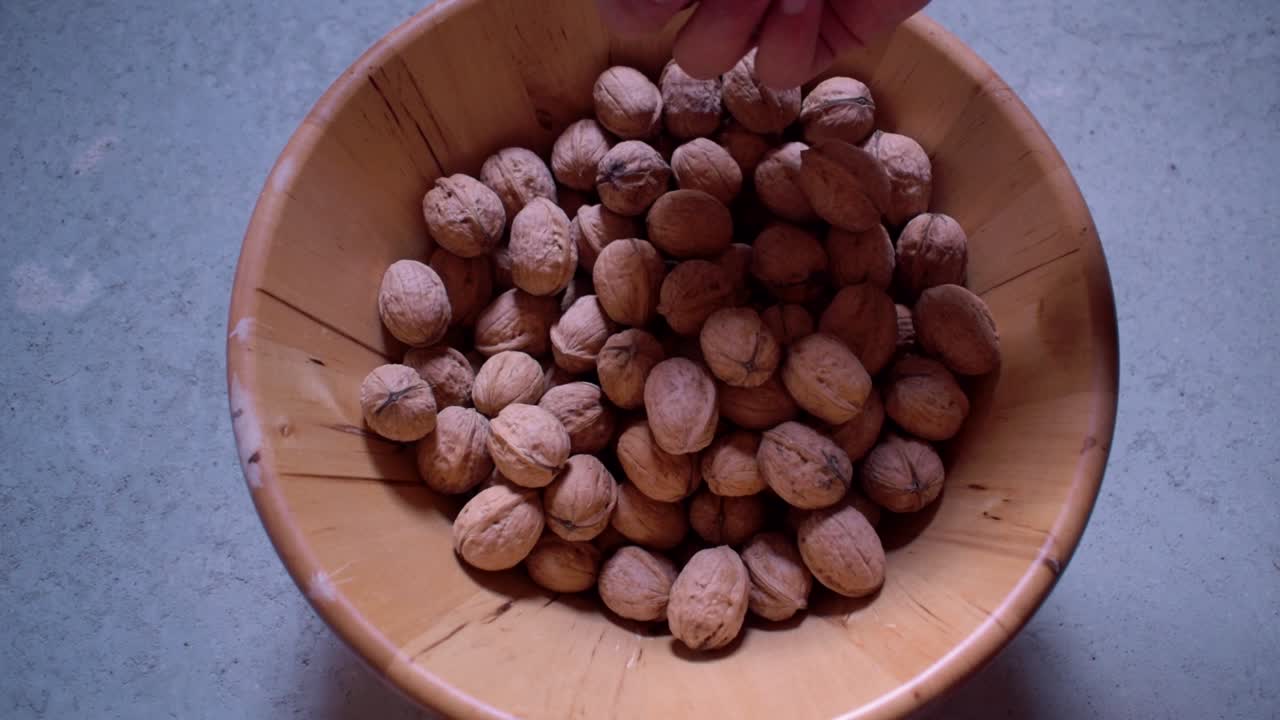 Dried walnuts in a wooden bowl-3