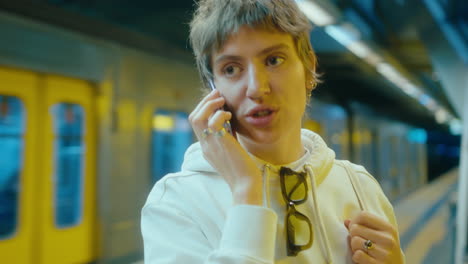girl chatting on the phone in subway
