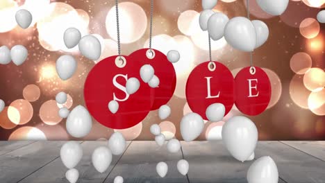 sale graphic on red tags with balloons