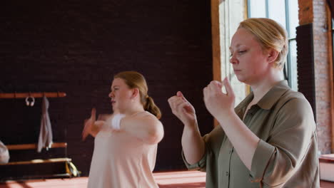 women warming up indoors