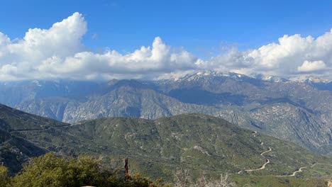 sunny day atop the mountain peaks of kings canyon in california, camera panning right