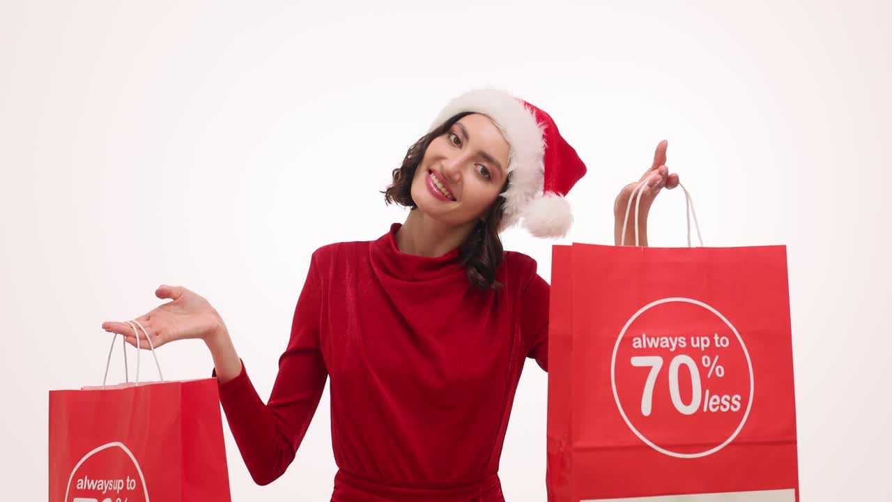 A woman in a Santa hat presents red shopping bags with a "70% less" discount