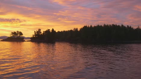 amazon sunrise on remote lonely bay deep in great bear rainforest, canada, pacfic