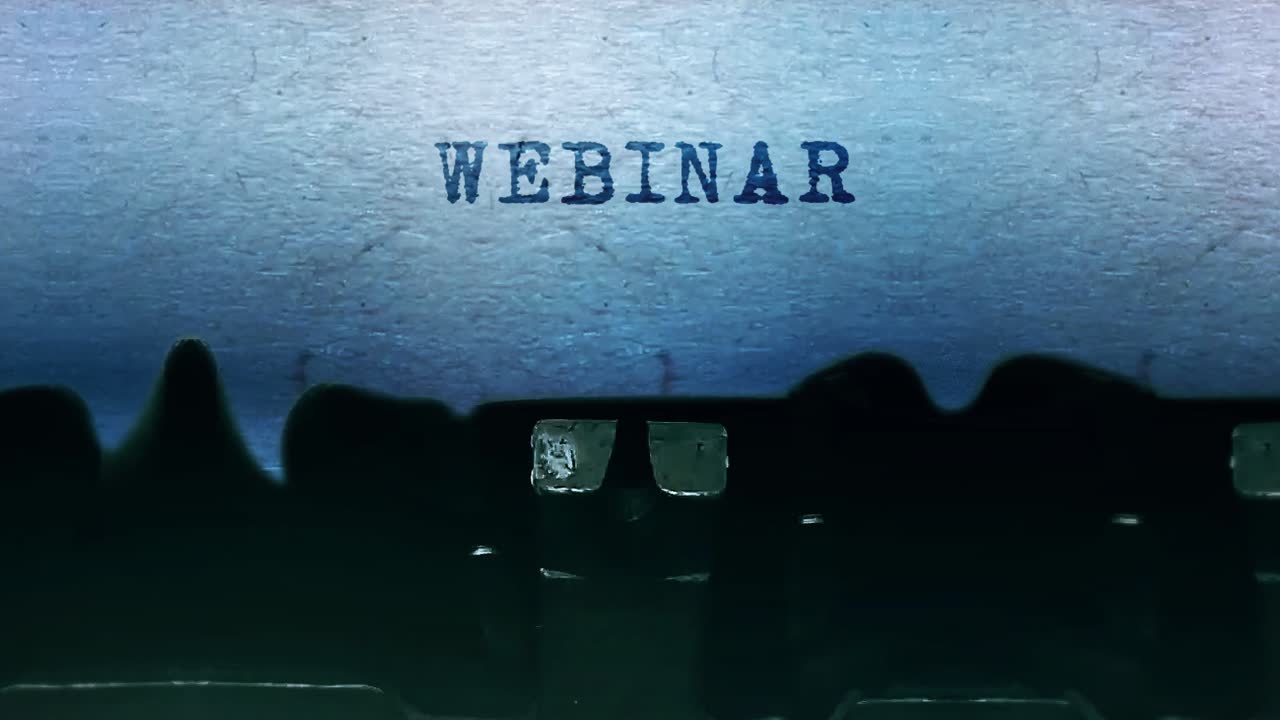 Webinar word closeup being typing and centered on a sheet of paper on old vintage typewriter