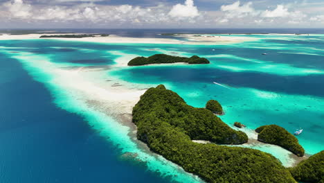 scenic cinematic aerial drone shot hovering and circling the glowing waters and emerald islands of palau. wide cinematic orbiting shot
